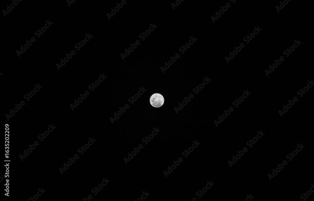 Lunar surface glowing under a black sky, with soft fog and cloud layers. A peaceful yet eerie night scene ideal for eclipse or astronomy themes. Lunar surface glowing under a black sky, with soft fog and cloud layers. A peaceful yet eerie night scene ideal for eclipse or astronomy themes.