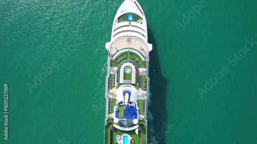 Cruise ships sail the seas, taking passengers and tourists on vacations to various places around the world.