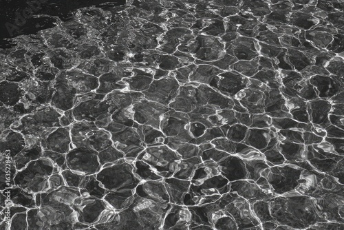 Abstract grayscale image of rippled water surface