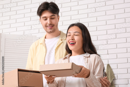 Happy young couple with par...