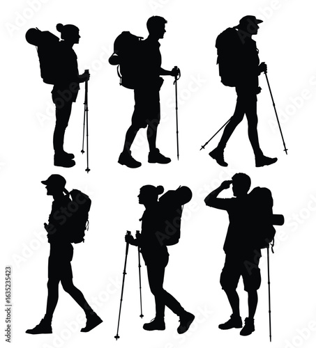 Silhouettes of hikers with backpacks and hiking poles