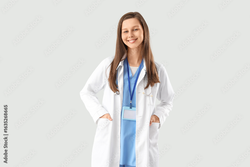 Female medical intern on light background Female medical intern on light background
