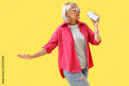 Mature woman in sunglasses ...