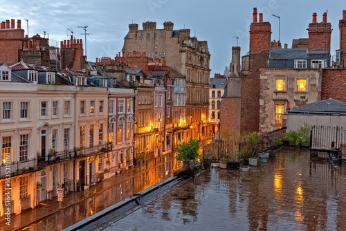 Rainy evening view of a historic English street