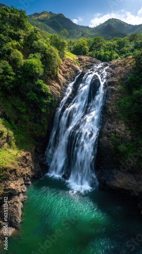 Lush waterfall cascading into a tranquil pool.