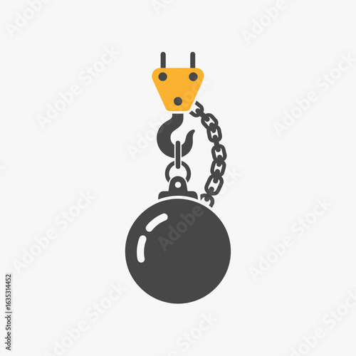 A black wrecking ball hangs from a yellow crane hook with a chain.