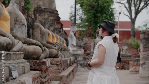 Wallpaper Mural Beautiful Asian woman travel with ancient pagoda at Wat Chai Wattanaram Ayutthaya, Thailand. Old pagoda the famous landmark in Ayutthaya, Thailand Torontodigital.ca