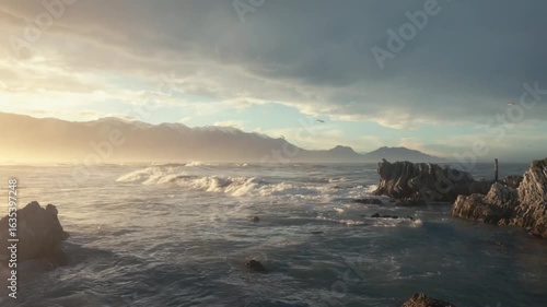 Waves crashing onto a rocky shore in a remote part of New Zealand