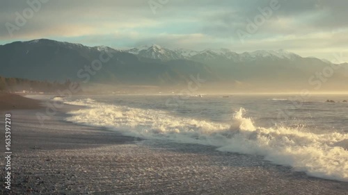 Waves washing onto a rocky shore at sunset