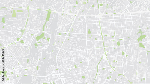 Vector aerial view of a city map featuring a network of streets and scattered green spaces in a muted color palette