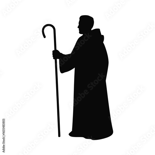 Silhouette of a shepherd holding a crook