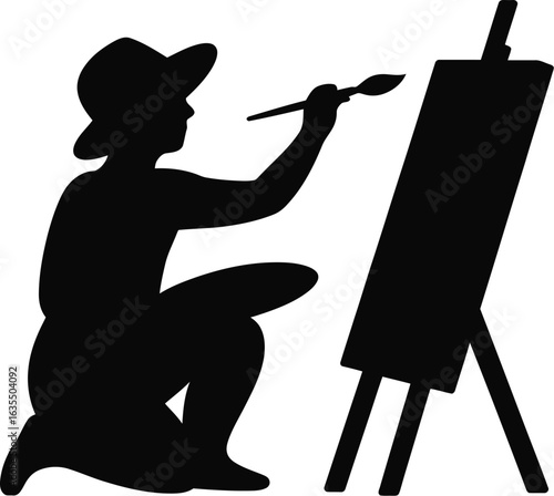 Artist painting on easel brush