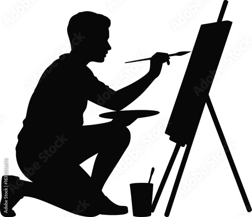 Artist painting on easel brush palette