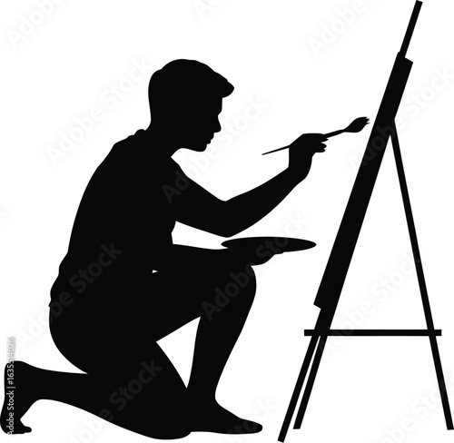 Artist painting on easel brush palette