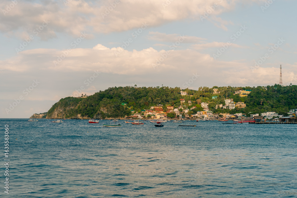 Naklejka premium Puerto Galera, Philippines - 3 may 2025 a tourist destination , need a ferry ride to get to this Island