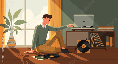 A young man sits on a sunlit floor, carefully placing a vinyl record onto a turntable to listen to music.