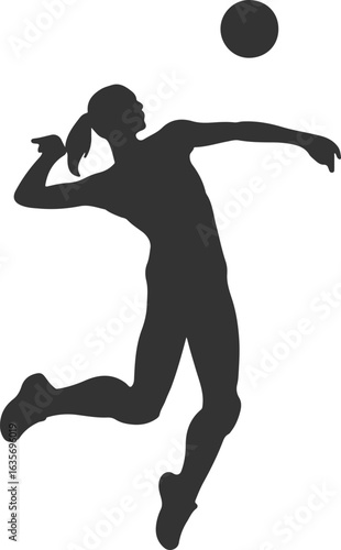 Silhouette of a female volleyball player spiking the ball during a game