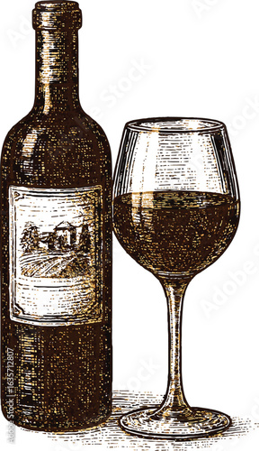A bottle of red wine stands next to a filled wine glass