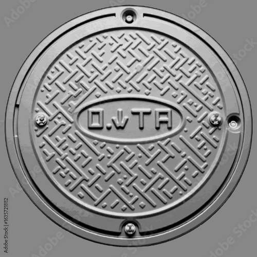 Detailed manhole cover design on gray surface, urban infrastructure