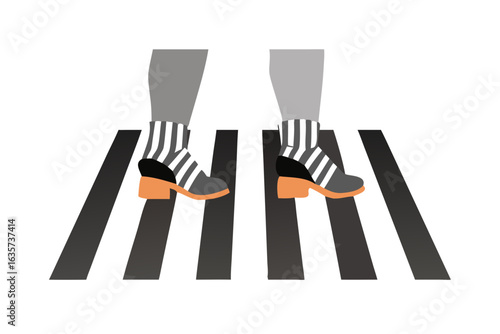 Stylish feet in striped socks and heels on a crosswalk