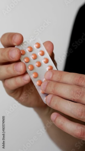 Colored tablets in the hands of the patient.
Tablets for viruses and colds in blister packaging.
Plate with medicine. Concept of medicine and health.
Health problems and treatment