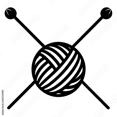 Black knitting needles crossed over yarn ball craft
