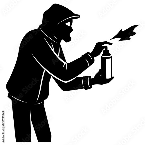 Black silhouette of person spraying paint graffiti