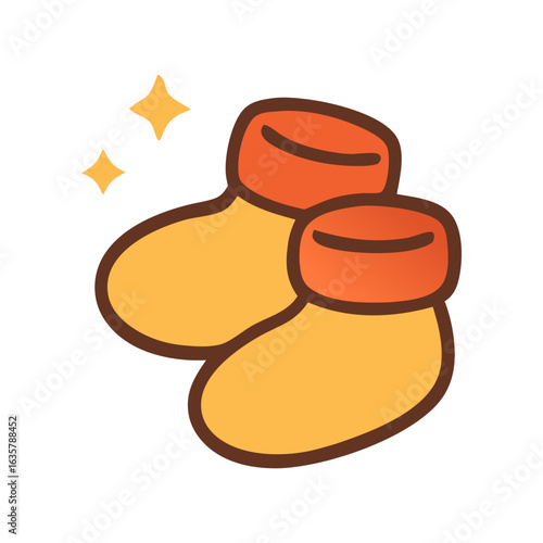 Two shiny golden baby booties with orange cuffs and outlines, perfect for baby product advertisements or nursery decor projects.