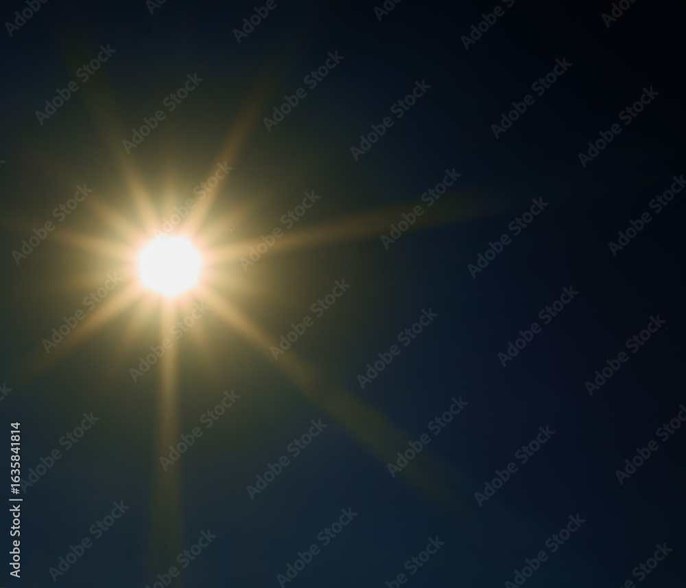 Fototapeta premium bright sun shines in the blue sky