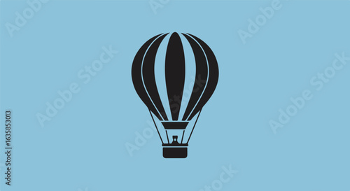 Hot air balloon flying in a blue sky. Use for travel, vacation, exploration
