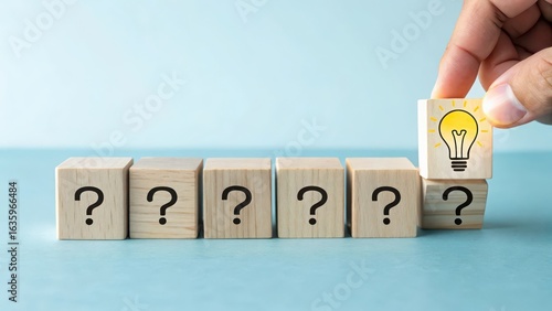 Business solution concept, idea generation and problem solving with lightbulb and question mark blocks