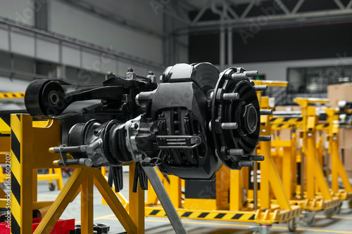 Heavy-Duty Trailer Axle on Assembly Stand in Industrial Workshop