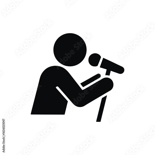 Silhouette of a speaker on stage using a microphone delivering a speech or performance with confidence and professionalism communication and public speaking concept