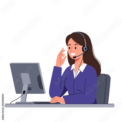 A woman with a headset sits at a desk, smiling and gesturing while looking at a computer screen.