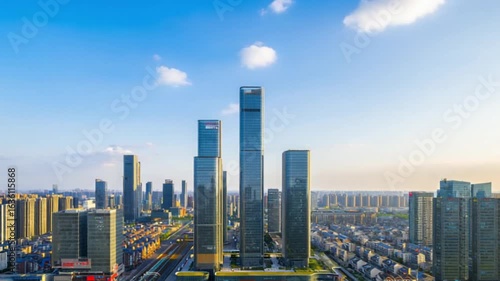 High Angle View of Modern City Skyline with Tall Skyscrapers Under Blue Sky and Clouds — 4K HD Video Footage Download, Cinematic Photorealistic Urban Panorama