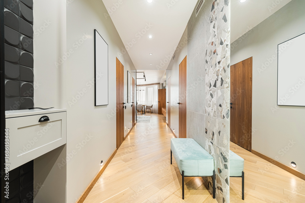 Fototapeta premium Modern hallway featuring stylish decor and inviting seating in a contemporary home setting