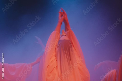 Ethereal dance performance captivates audience with flowing movements and haunting atmosphere in an enchanting setting