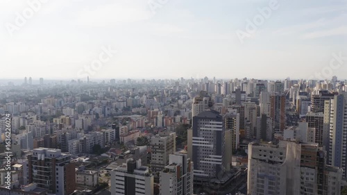 Wallpaper Mural Drone view of central Curitiba with dense high-rise buildings and hazy sky in the distance. Torontodigital.ca