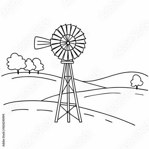 Rural windmill on a farm landscape with copy space for sustainable agriculture and renewable energy ideas; pastoral tranquility