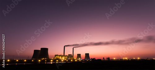 Industrial Power Plant at Dusk with Smoke Emissions