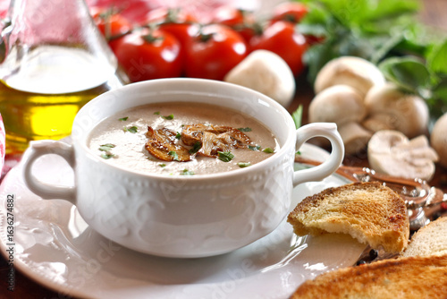 Creamy mushroom soup in ceramic bowl
