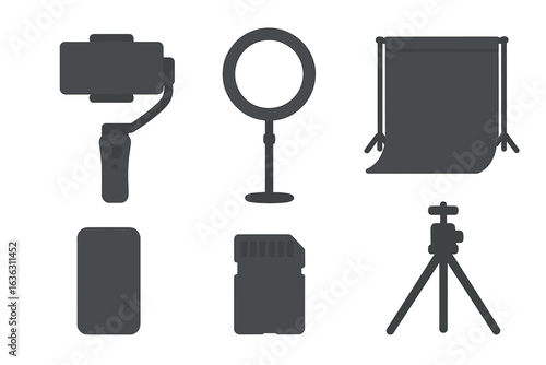 Equipment set for mobile videography featuring lights, stabilizers, and a backdrop for content creation in studio space