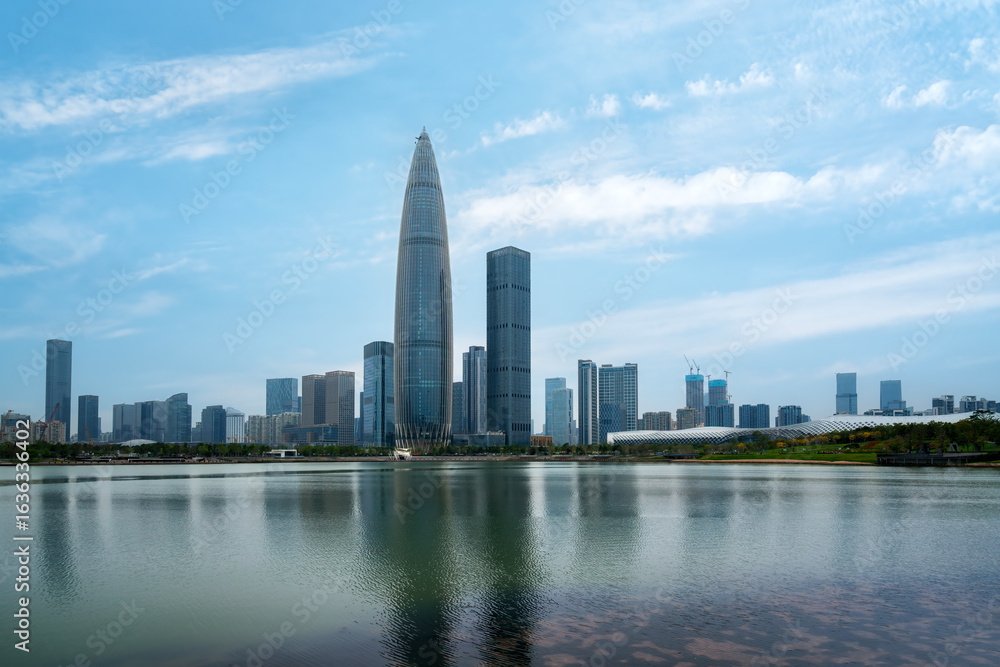 Obraz premium Modern City Skyline with Skyscrapers and Reflective Lake