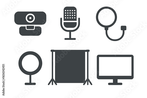 Equipment for content creation including microphones, cameras, and monitors arranged on a workspace