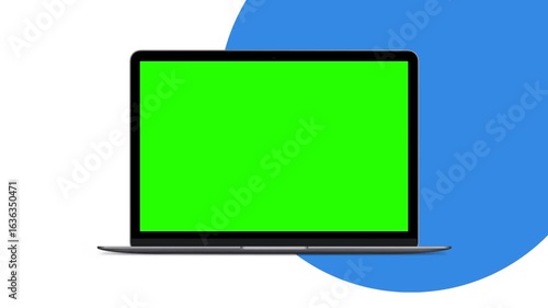 A gray laptop with a vibrant green screen displays a blank template, ideal for showcasing video or image overlays.
