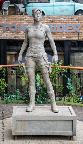 Statue of lara croft from tomb raider. Stone sculpture of famous video game character hero and movie film icon