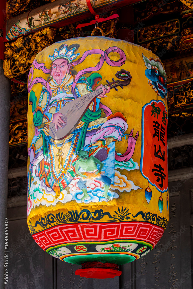 Fototapeta premium The traditional latern outside of Lungshan Temple in Taipei’s Wanhua District (also known as Monga) features traditional Chinese architecture with intricately carved wooden beams, colorful.