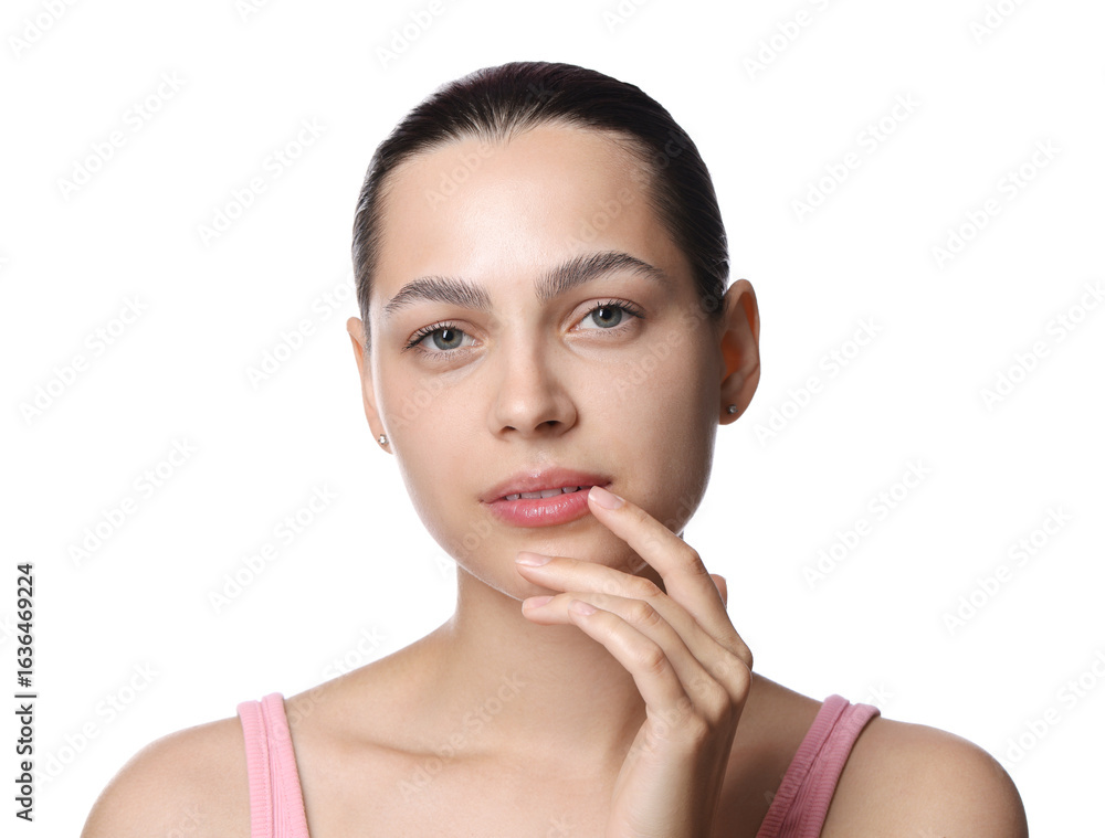 Young woman with lip balm on white background Young woman with lip balm on white background
