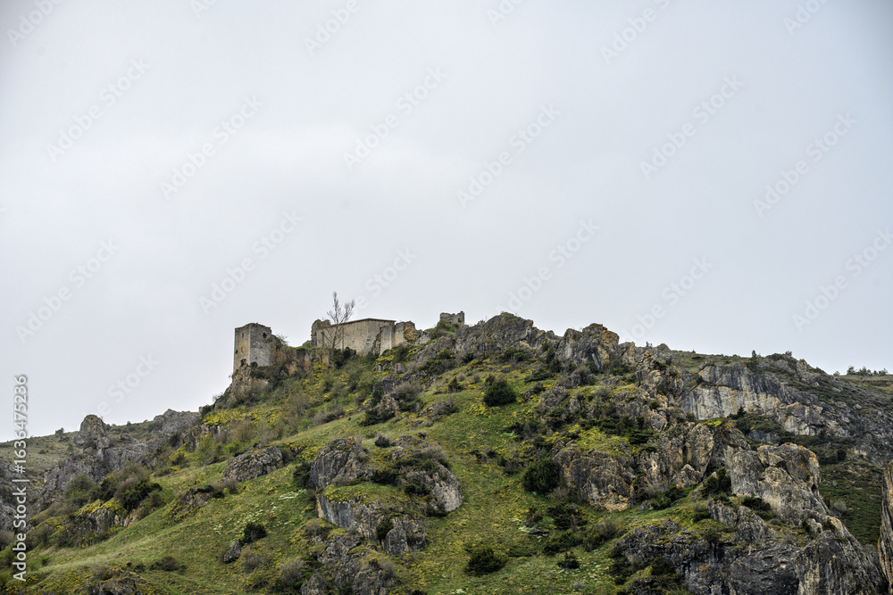 Fototapeta premium Ruins of Gama Castle on rocky hilltop in Aguilar de Campoo, Palencia