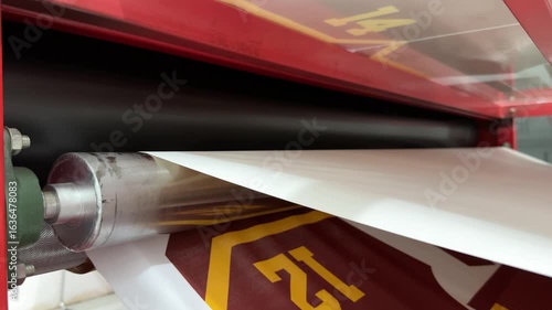 Fabric and print paper after the printing process on the roll press transfer machine